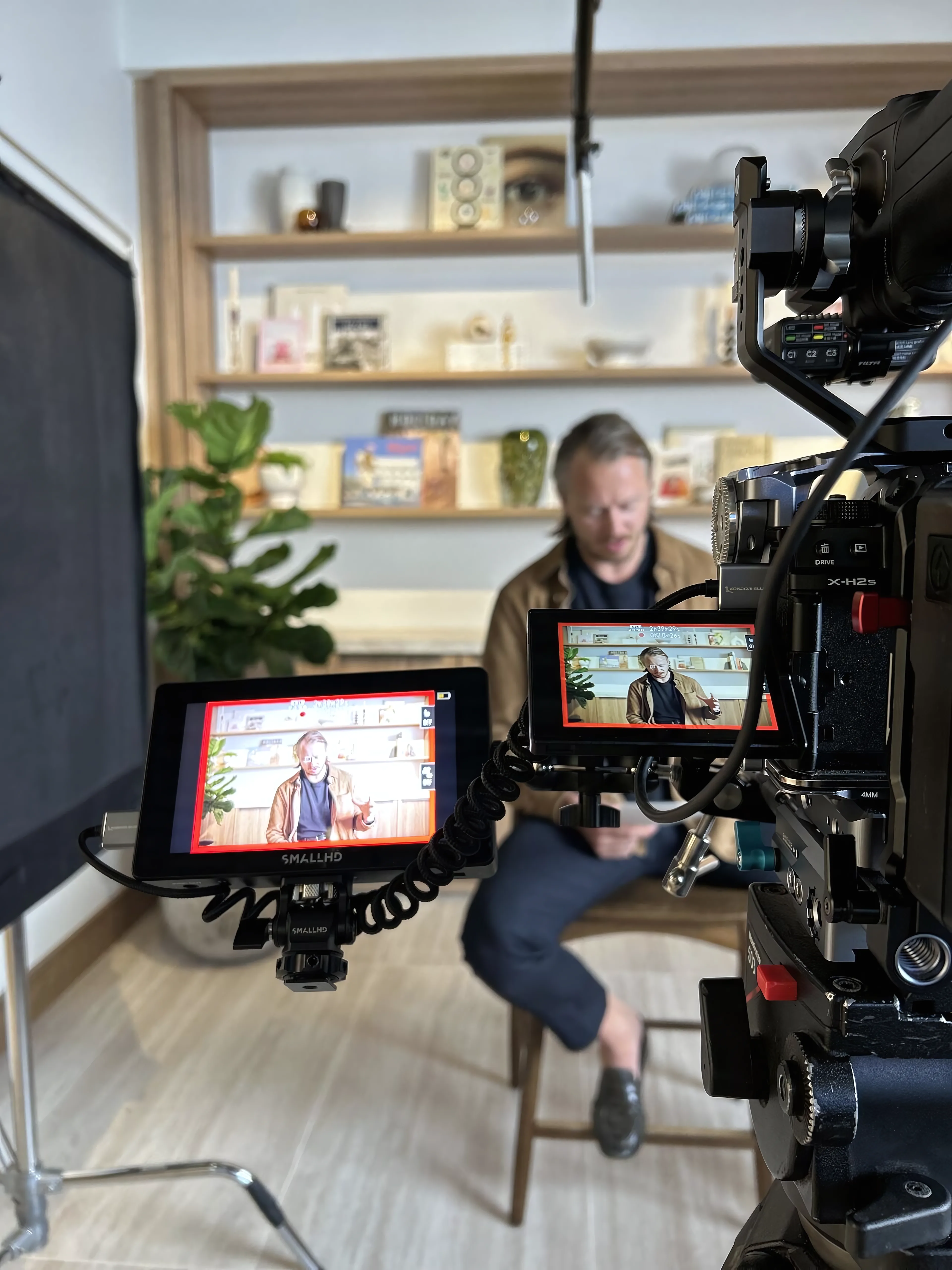 Camera and monitors set up for a filmed interview